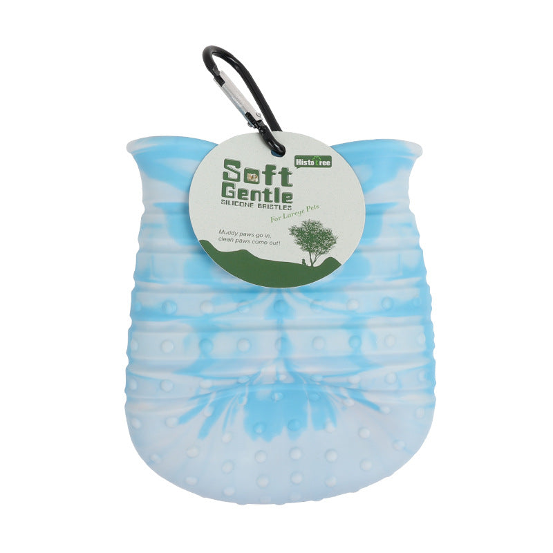 2-in-1 Blue pet paw cleaner being used as a grooming brush for pet care.