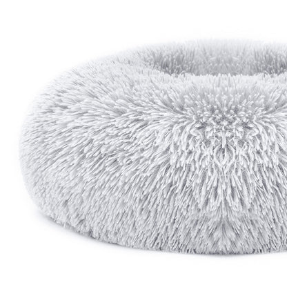 Fluffy gray pet bed on a white background