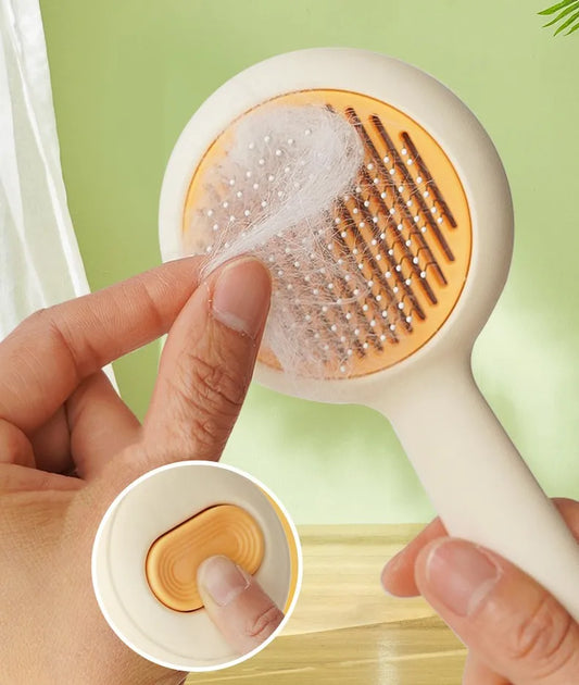 Self-Cleaning Cat & Dog Brush – One-Click Pet Hair Remover & Grooming Comb.